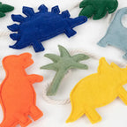 Vilten dinosaurus slinger